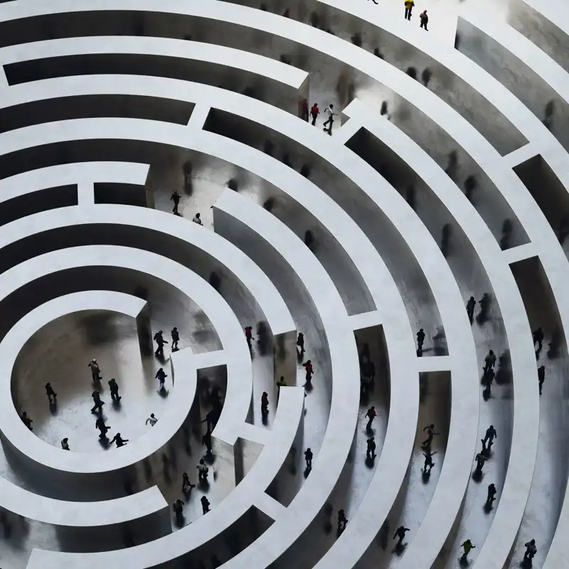 Aerial view of a maze with business professionals walking