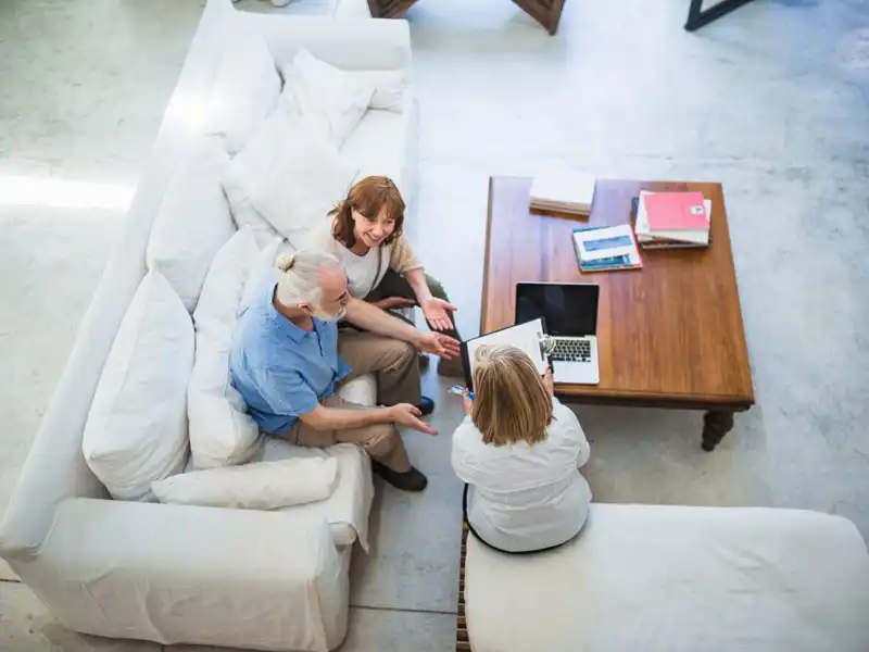 Financial advisor in a meeting with a senior couple.