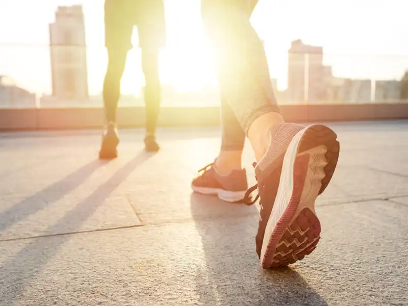 Close-up on woman's legs and sneakers.