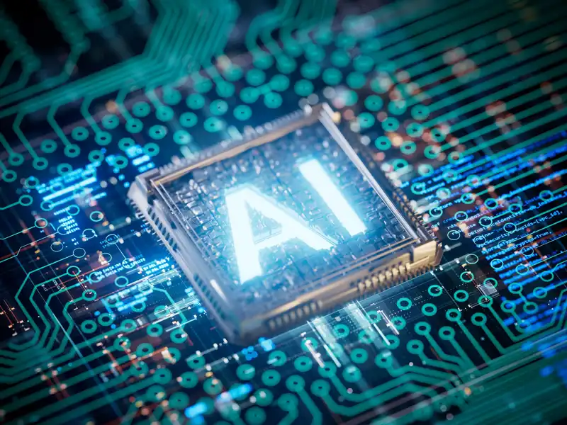 Close up of a microchip with AI glowing brightly.