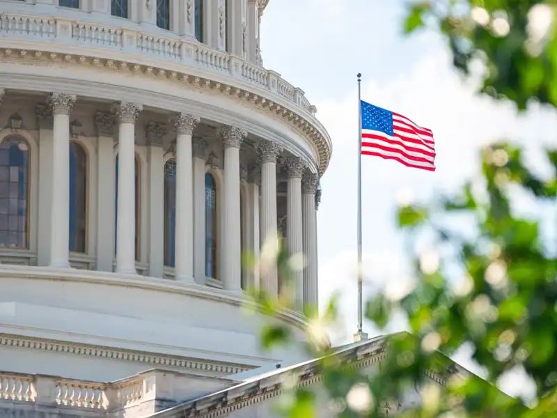 An American flag flies outside the United States Capitol Building