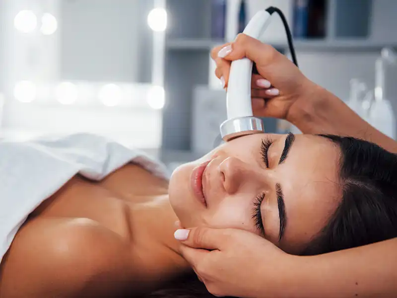 Person receiving a facial in a spa.