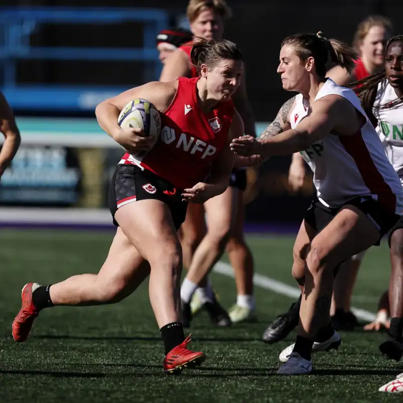Rugby Canada player running the ball.